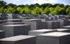 You can see a persons head popping up through the concrete blocks at the Jewish Memorial