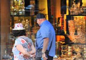 Fiona and Gary looking at all the glitzy stuff in a shop window.